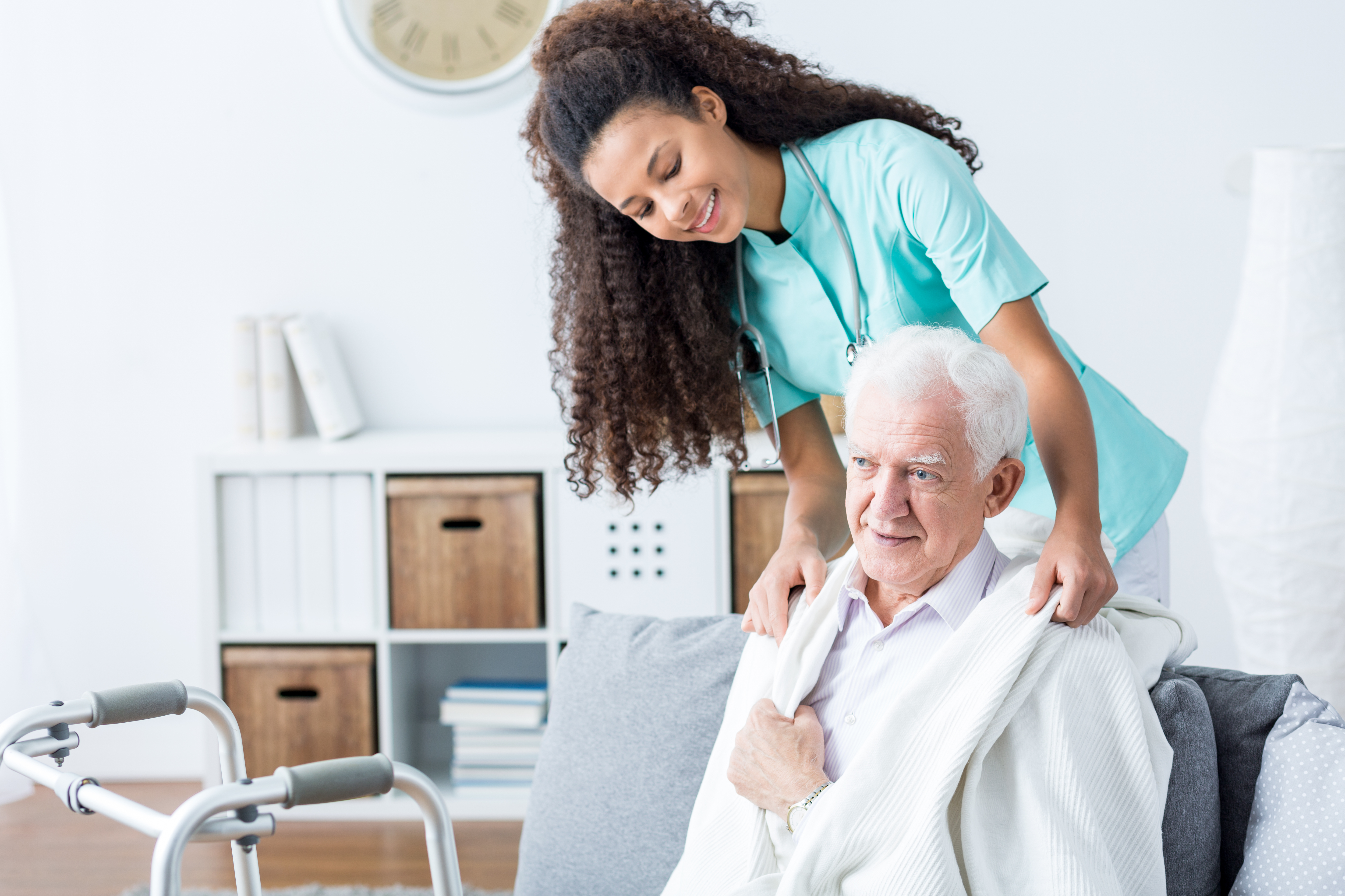 A Nurse Taking Care Of An Elderly
