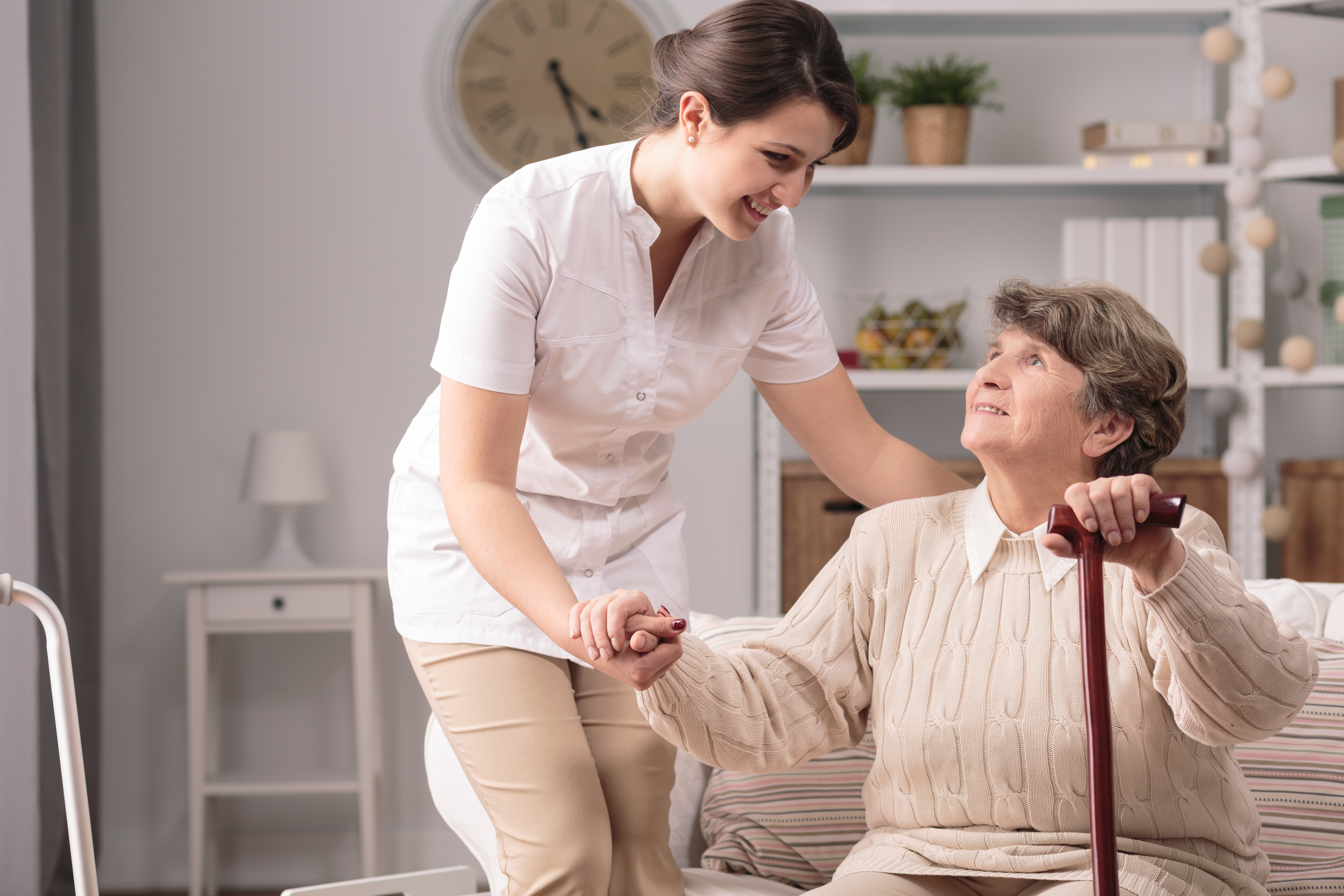 A Nurse Helping An Elderly woman